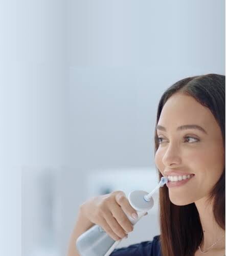 Lady using water floss