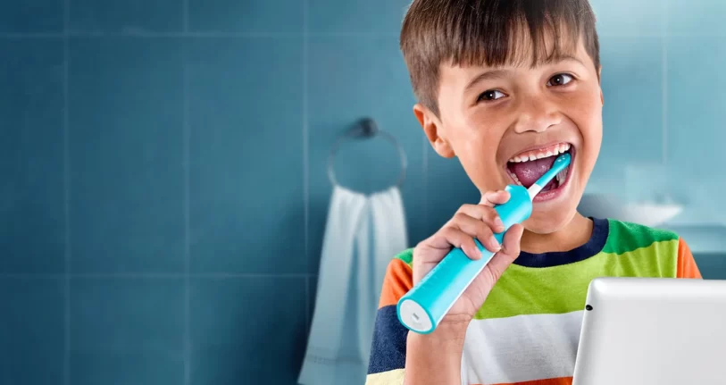 electric toothbrush in kids hand